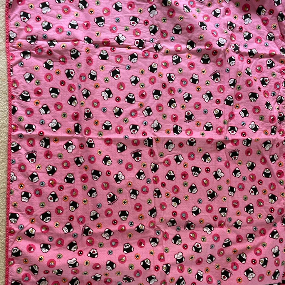 Taj kids blanket, pink with spam musubi characters.  Approximately 42” x 33”